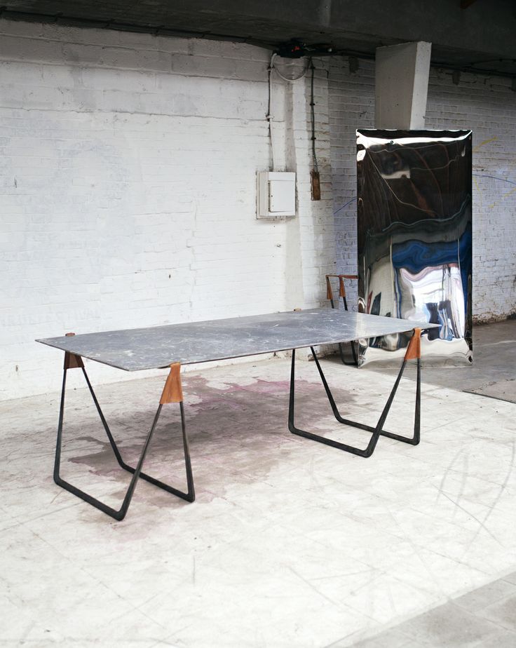 In Vein table in use and against the wall